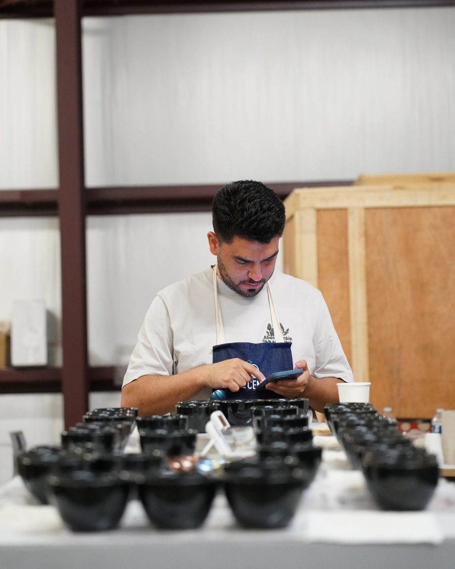 Nicolas Bernal at a cupping table, evaluating coffee samples